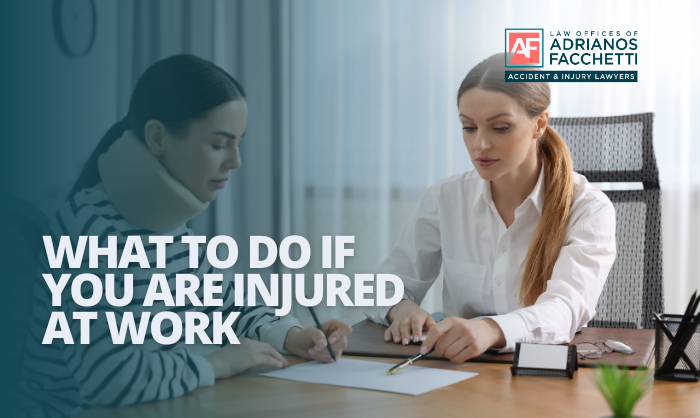 An injured worker wearing a neck brace discusses her case with a legal professional at an office desk, reviewing paperwork for a workers' compensation claim