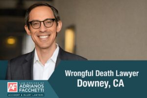 Downey wrongful death lawyer Adrianos Facchetti smiling in a suit at the Law Offices of Adrianos Facchetti