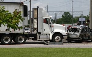Semi truck and heavily damaged SUV after a collision on a city street near El Monte