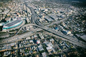 Aerial view of Los Angeles rush hour traffic on stacked downtown freeways near the convention center, used on a Los Angeles car accident lawyer website.