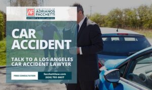 Los Angeles Car Accident Lawyer From The Law Offices Of Adrianos Facchetti Standing Beside A Crashed Car With Contact Details For A Free Consultation.