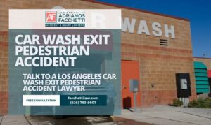 Exterior of a car wash in Los Angeles with an SUV at the exit and text offering help from a car wash exit pedestrian accident lawyer at the Law Offices of Adrianos Facchetti