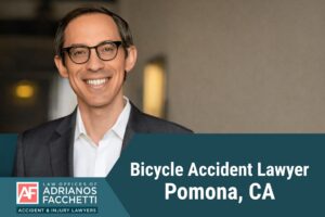 Pomona bicycle accident lawyer Adrianos Facchetti smiling in a professional headshot with text reading Bicycle Accident Lawyer Pomona, CA
