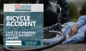 Pomona bicycle accident lawyer helping an injured cyclist on the road
