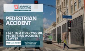 Adrianos Facchetti, Hollywood pedestrian accident lawyer, reviewing a crosswalk injury claim with an injured pedestrian in Los Angeles County.