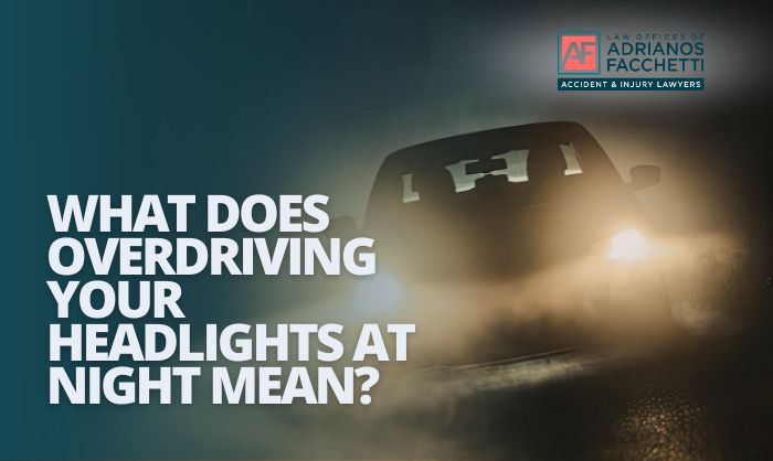 A vehicle driving on a dark road at night with headlights illuminating a limited stretch ahead, illustrating the concept of overdriving your headlights and the risk of nighttime car accidents in California.