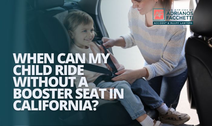 A child properly secured in a booster seat with the seat belt fitting correctly across the chest and hips, illustrating California car seat law and child passenger safety.