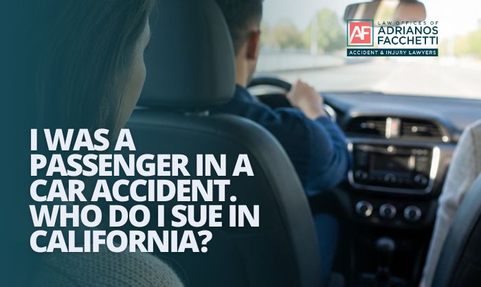 An injured passenger sitting in the back seat of a car after a California car accident, illustrating the passenger injury claim topics discussed in this article